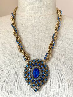 "Stunning vintage Art Deco sapphire blue rhinestone pendant necklace. This gorgeous necklace was designed around a most beautiful vintage rhinestone brooch.   The beautiful rhinestones have the most vibrant sapphire blue stones in square, round and pear shapes, with a beautiful oval center stone. It's in wonderful vintage condition, and has such a lovely sparkle.  I added a vintage chunky rope chain along with vintage blue rhinestone chain. The necklace measures 24\" long and fastens with a spri Pear Shapes, Vintage Rhinestone Brooch, Gold Rope Chains, Rhinestone Chain, Blue Stones, Sapphire Blue, Blue Rhinestones, Vintage Rhinestone, Gorgeous Necklaces