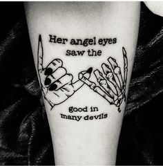 a person with a tattoo on their leg that says her angel eyes saw the good in many devils