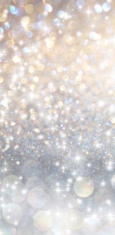 an abstract background with sparkling lights and stars