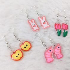 PLEASE READ DESCRIPTION BEFORE PURCHASING ✦ITEM DESCRIPTION✦ ⭑ One sided shrink plastic (polystyrene plastic) charm, colored with paint pens/ colored pencils & sealed with UV resin ⭑ Attached to earring hooks ⭑ Charms are about 1.5-2cm in length! ✦NOTE✦ Each item is handmade and may have minor imperfections (such as bubbling in the resin). If the name of the item mentions it being B grade, it means that its imperfections are more visible up close, and its price has been discounted to reflect it. ✦SHIPPING✦ ⭑ Orders will be sent out within 1 week of purchase. ⭑ All orders are sent via USPS first class package in a bubble mailer and include tracking. Thank you for the support! If you need any help or have any issues with an order, please let me know! Plastic Shrink Keychain, Shrink Plastic Ideas, Shrink Plastic Charms, Shrink Plastic Earrings, Kandi Ideas, Plastic Earrings, Kawaii Jewelry, Shrink Plastic, Bubble Mailer