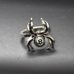 Silver Spider Ring

Statement gothic jewelry featuring an insect design with the number 8 etched. Perfect for punk or alternative styles.

-Size 7, only one available 
-0.8” height 
-Durable piece
-The band is oval shaped 
-Steel

4B

#spider #gothic #edgy #insect #goth Spider Ring, Insect Design, Spider Jewelry, Jumping Spider, Number 8, 7 Rings, Ring Color, Gothic Jewelry, Women Accessories Jewelry