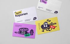 three business cards with different designs on them