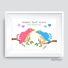 two birds sitting on top of a tree branch with hearts in the sky behind them