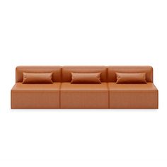 an orange couch with four pillows on the back and one pillow on the side, in front of a white background