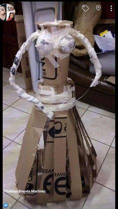 a cardboard dress made to look like it is wrapped in tape and taped around the neck