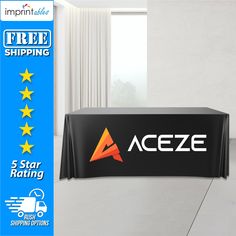 a black table cloth with the aceze logo on it and five stars around it