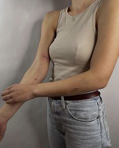 a woman with her arm wrapped around the wrist