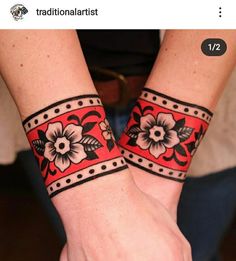 two wristbands with flowers on them are shown in this photo, one is red and the other is black