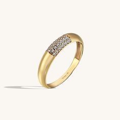 The Minimalist Pave Dome Ring has an elegant design that its plainness with sparkling stones is the modesty which will fascinate people around you. It is perfect for everyday use and ring stacking. - Made in 14k Solid Gold - Decorated with handset white cubic zirconia stone on 14k solid gold - Band Width: 2.50 mm / 0.0 Elegant White Gold Dome Promise Ring, Classic White Gold Dome Ring With Pave Setting, Elegant White Gold Dome Ring With Single Cut Diamonds, Modern White Gold Dome Ring With Diamond Accents, Elegant Dome Ring With Pave Setting For Formal Occasions, Modern Dome Ring With Diamond Accents, Everyday Luxury Diamond Ring With Pave Setting, Elegant Diamond White Dome Ring For Formal Occasions, Elegant Cubic Zirconia Dome Ring With Prong Setting