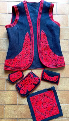 "Authentic Hungarian vest with sewn red Kalotaszeg pattern on it. Unique black and red soft felt folk vest with accessories : a purse, a key case, a doily, a documents case. The pattern is called IRASOS-\"written\" embroidery, a true expression of Kalotaszeg and Transylvanian culture and the pride of its people. Size S" Traditional Red Vest For Festival, Black Folk Style Festival Vest, Traditional Black Vest For Festival, Written Embroidery, Folk Vest, Felt Vest, Vest Ideas, Vest Pattern, The Pride