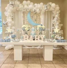 a baby shower party with balloons and decorations