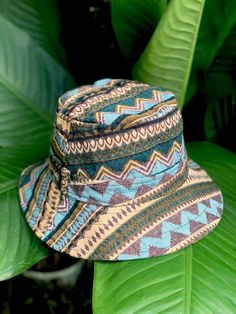 Artisan Bucket Hat | Boho-inspired bucket hat featuring a woven design with mixed patterns This Bucket Hat is made from 100% natural organic cotton ,        Hat is unisex fit great on both men and women Measurements  Large - inner circumference is 24" inches Brim 2" **These hats are handmade and so will vary slightly Blue Wide Brim Bucket Hat For Festivals, Adjustable Green Hats For Festivals, Brown Bucket Hat For Festival, Adjustable Green Hat For Festivals, Adjustable Green Hat For Festival, Green Festival Cap, Blue Bucket Hat With Curved Brim For Festivals, Blue Bucket Hat With Short Brim For Festivals, Blue Bucket Hat For Vacation