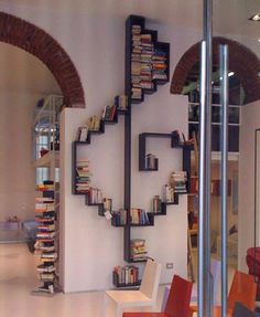 the bookshelf is made out of metal pipes