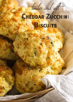 a basket filled with cheesy biscuits on top of a table