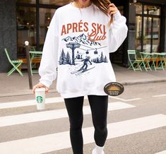 Après Ski Sweatshirt" is the perfect cozy addition for those post-slope gatherings or winter festivities. Whether you're at a ski resort, a mountain getaway, or a bachelorette party in Aspen, this sweatshirt brings style and warmth. Ideal for ski-themed parties, camp bachelorette weekends, or simply lounging by the fireplace after a day in the snow, it's a must-have for any winter adventure. Embrace the fun of the season with this stylish après-ski sweater that captures the spirit of snowy mount Ski Bachelorette, Mountain Bachelorette, Apres Ski Sweater, Ski Sweatshirt, Mountain Getaway, Ski Sweater, Winter Adventure, Bachelorette Weekend, Ski Resort