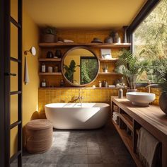 a bath room with a large tub and a sink under a round mirror next to a window