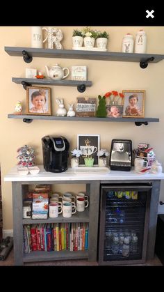 a coffee bar with shelves and pictures on the wall