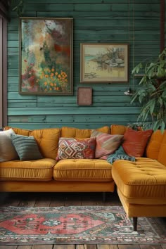 a living room filled with furniture and paintings on the wall