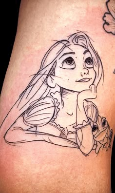 a girl and her doll tattoo on the thigh