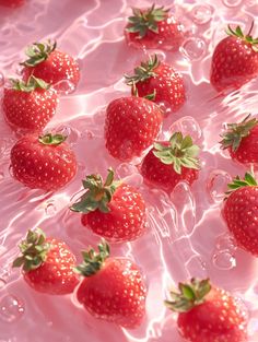 many strawberries are floating in the water