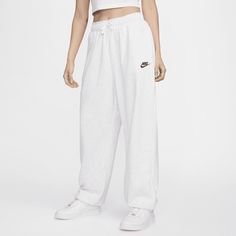 Soft and warm, these oversized Club Fleece sweatpants are perfect for days when comfort is everything. Loose through the hip and thigh, the leg is finished with an elasticated cuff at the ankle for a perfectly cinched-in look. Nike Wide Leg Joggers, Nike Just Do It Sweatpants, Nike Oversized Fit Sweatpants, Nike Lose Fit Sweatpants, Nude Nike Sweatpants, Nike Womens Oversized Sweatpants, Nike Rally Sweatpants, Nike Cuffed Sweatpants Women, Pastel Nike Sweatpants