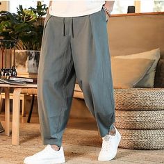 Category:WE-Pants; Season:Spring  Summer; Fabric:Linen / Cotton Blend; Gender:Men's; Style:Fashion,Casual; Elasticity:Inelastic; Occasion:Outdoor,Daily,Holiday; Fit Type:Regular Fit; Function:Comfort; Waistline:Mid Waist; Pattern:Plain; Design:Elastic Waist,Drawstring; Pants Type:Summer Pants,Pleated Pants,Linen Pants,Beach Pants,Trousers; Fly Type:Elasticity,Drawstring; Front page:FF; Listing Date:02/15/2023; Production mode:External procurement; Hips:; Length:; Waist: Red Pants Men, Linen Pants Style, Grey Pants Men, Navy Pants Men, Streetwear Plus Size, Linen Harem Pants, Harem Pants Men, Black Harem Pants, Camouflage Cargo Pants