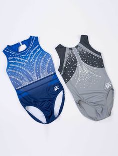 two men's swimsuits sitting next to each other on a white surface