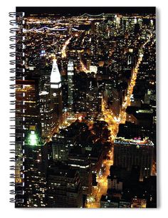 an aerial view of the city at night spiral notebook