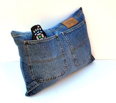 a cell phone in a pocket made out of jeans