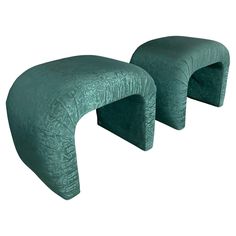 two green velvet stools with curved legs