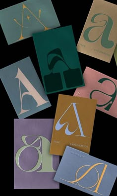 six different types of folded paper with the letter s on them in gold, blue, and green