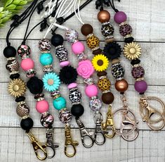 several different types of key chains with flowers on them