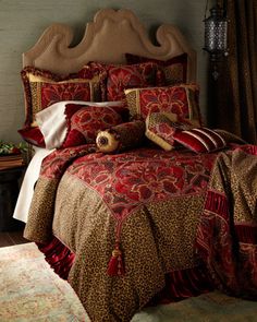 the comforter is red and brown with leopard print