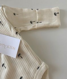 These beautiful ribbed onesies are 100% cotton, they feature snap lock buttons across the nappy area and 3 buttons below the collar. Fold over cuffs have been included as an option to have hands covered. These bodysuits suit all seasons, add bloomers, tights or wear as is! Snap Lock, Fold Over, Palm Tree, All Seasons, Onesies, Baby Onesies, Tights, Cuff, Collar