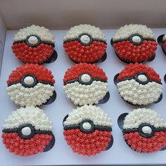 twelve decorated cupcakes with red and white frosting in the shape of pikachu