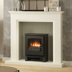 a white fireplace with a black fire place