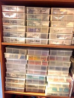 a book shelf filled with lots of plastic containers