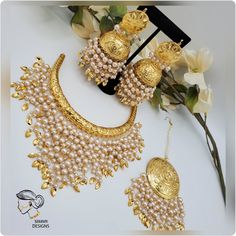 DETAILS:- kirat gold plated hasli set Very fine quality, handmade gold plated set Comes with Statement jhumkis and tikka Extremely lightweight JJhumka length:- 3.4 inches Gold Chandbali Jewelry Sets, Festive Gold Kundan Sets, Gold Meenakari Chandbali Jewelry Sets, Gold Kundan Hand Set Jhumkas, Ceremonial Chandbali Kundan Necklace In Gold Plated, Ceremonial Gold Plated Chandbali Kundan Necklace, Gold Bollywood Hand Set Jhumkas, Hand-set Gold Jhumkas Bollywood Style, Festive Gold Plated Jewelry Set With Latkans