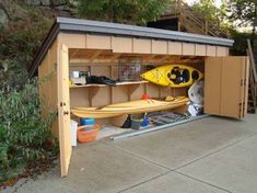 a garage with two kayaks in it