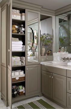 the bathroom is clean and ready to be used as a storage area for towels or other items