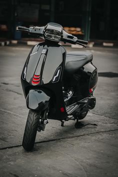 a black scooter is parked on the street