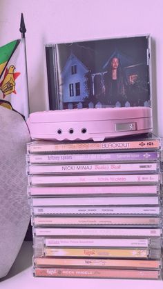 a stack of cds sitting on top of a table