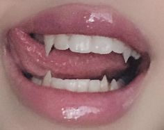 a woman's mouth with white teeth and pink lipstick