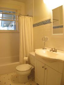 a bathroom with a sink, toilet and bathtub