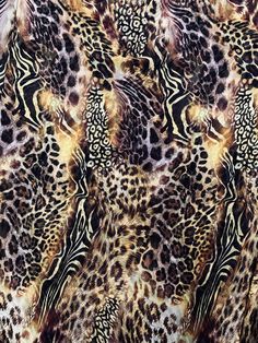 an animal print fabric with different colors and patterns