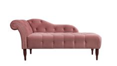 a pink velvet chaise lounger with wooden legs and tufted upholster