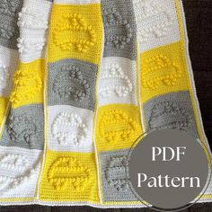 a yellow and gray crocheted afghan is shown with the text, free pattern