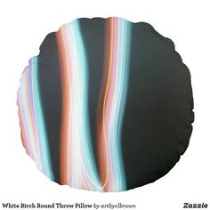 a round pillow with multicolored lines on it