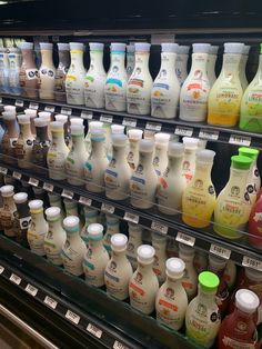 a display case filled with lots of different types of milk