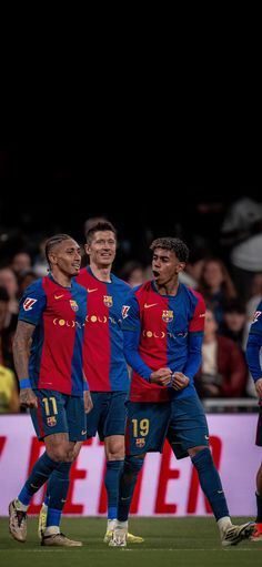 the soccer players are standing together on the field